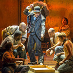 Kingsley Leggs, center, as Sporting Life and the cast of The Gershwins’ Porgy and Bess. Photo by Michael J. Lutch.