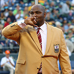 Former Seahawk Walter Jones kisses his Hall of Fame ring after receiving it during a half-time celebration at the Seahawks 2014 home-opener against Green Bay. Staff Photo/Khalid Bennett