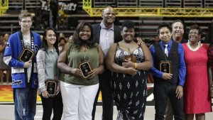 Hall of Fame quarterback Warren Moon, center, with the 2014 scholarship recipients of his non-profit organization, The Crescent Moon Foundation. Photo courtesy of The Crescent Moon Foundation.