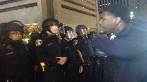 A young man in Baltimore yells his frustrations at police in riot gear. Photo/Hazel Trice Edney.