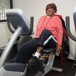 Juanita Dance enjoys working out on an exercise bike. Photo/C.B. Bell.