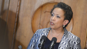 Attorney General Loretta Lynch speaks during her swearing-in ceremony at the Justice Department. Lynch traveled to Baltimore on May 5 to discuss improving ties between the police and Black residents. NNPA Photo/Freddie Allen. 
