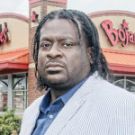 Bojangles&rsquo; customer James "J.J." Minor feels insulted by a manager&rsquo;s remark made when he returned fast food chicken box filled with cash. Photo/Sandra Sellars/Richmond Free Press