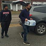 Residents are using bottled water because the city's drinking water supply is contaminated.  Howard students pitched in to help. 