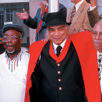 Carl Matthews, center, with other sit-in participants at the state historic marker for the sit-in. Matthew’s led the local lunch counter protest in 1960 that became North Carolina’s first victory for the sit-in movement. (FILE PHOTO/WSC)