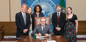 Gov. Jay Inslee signs HB 2700 into law.