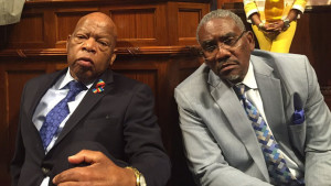 U.S. Rep. John Lewis sits with U.S. Rep. David Meeks (D., N.Y.)