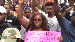Protestors march in the street following the shooting death of Alton Sterling in Baton Rouge, La. (The Drum)