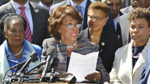 Rep. Maxine Waters (D-Calif.) reads from a letter that was later delivered to the Justice Department. In the letter, CBC members called for the Justice Department to investigate the killings of unarmed Blacks by law enforcement. Photo/Freddie Allen/AMG/NNPA.