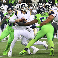 Seahawks defensive end Cliff Avril applies pressure to Rams quarterback Jared Goff. Staff Photo/Khalid Bennett.